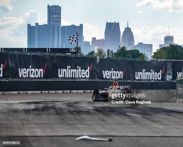 James Hinchcliffe of Canada drives the Honda Indy Car for Schmidt Peterson Motorsports with Vassier-Sullivan as a piece of car body lays on the track...
