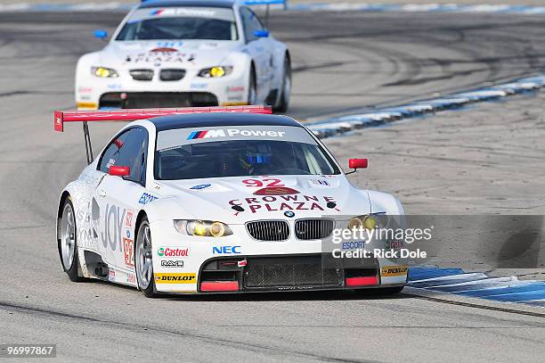 Tommy Milner drives the BMW Rahal Letterman BMW M3 in front of the team car of Dirk Muller, Joey Hand, and Dirk Werner during the American Le Mans...