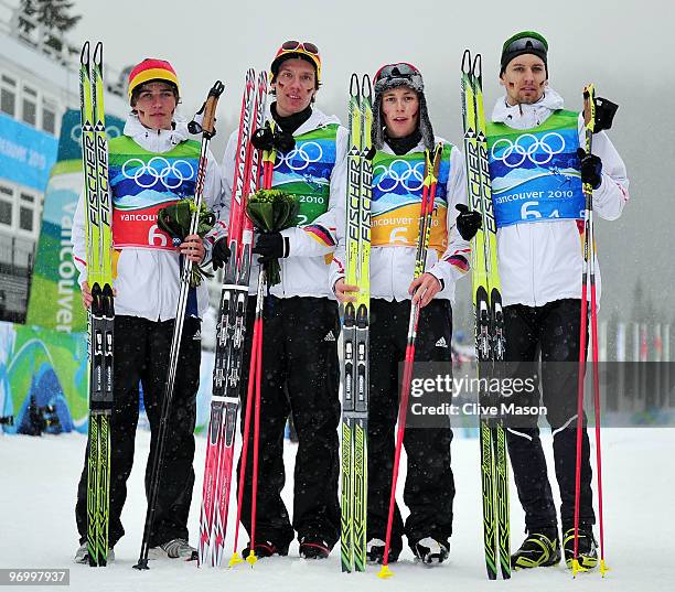 Team Germany Johannes Rydzek, Tino Edelmann, Eric Frenzel, and Bjoern Kircheisen celebrate after winning Olympic Bronze ini the nordic combined on...