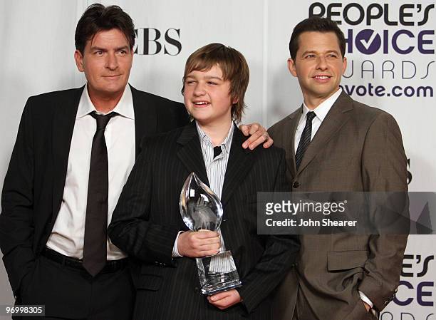 Actors Charlie Sheen, Jon Cryer and Angus T. Jones pose in the press room at the 35th Annual People's Choice Awards held at the Shrine Auditorium on...