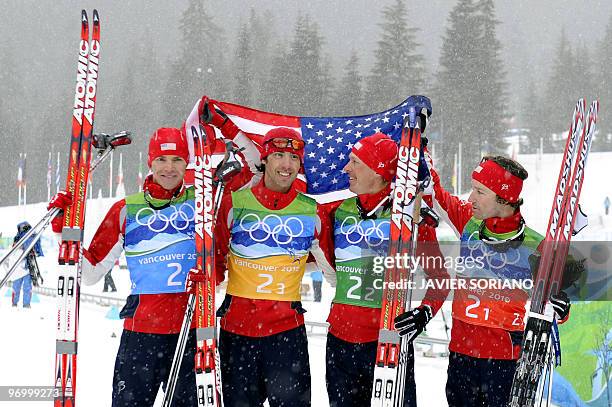 Bill Demong of the US and compatriots Johnny Spillane, Todd Lodwick and Brett Camerota react after the men's Nordic Combined team 4x5 km at the...
