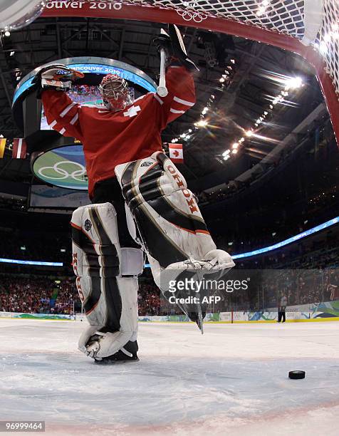 Swiss goalkeeper Jonas Hiller celebrates defecting the puck in the penalty shoot out giving Switzerland their 3-2 win over Belarus in the Men's Ice...