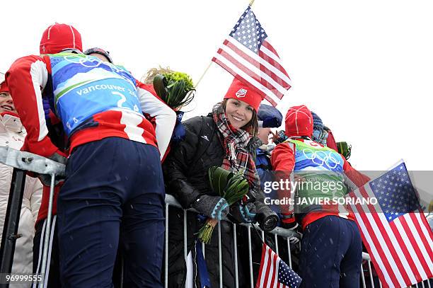 Bill Demong of the US Todd Lodwick of the US greest fans after the men's Nordic Combined team 4x5 km at the Whistler Olympic Park during the...