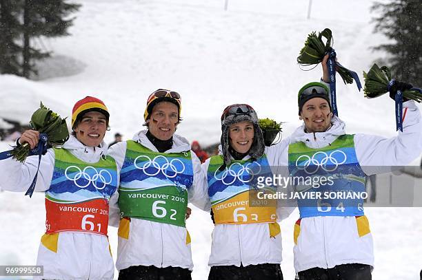 Germany's bronze medalists Johannes Rydzek, Tino Edelmann, Eric Frenzel and Bjoern Kircheisen attend the podium for the men's Nordic Combined team...