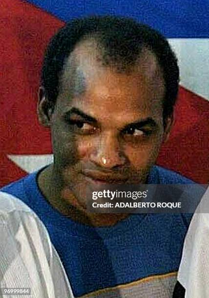 This March 11, 2003 file photo shows leading Cuban dissident Orlando Zapata posing before the Cuban flag with fellow dissidents at the start of a...