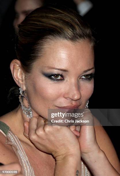 Kate Moss attends the Love Ball London at the Roundhouse on February 23, 2010 in London, England. The event was hosted by Russian model Natalia...