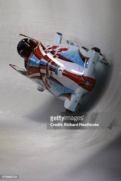 Sandra Kiriasis and Christin Senkel of Germany compete in Germany 1 during the Women's Bobsleigh Heat 1 on day 12 of the 2010 Vancouver Winter...