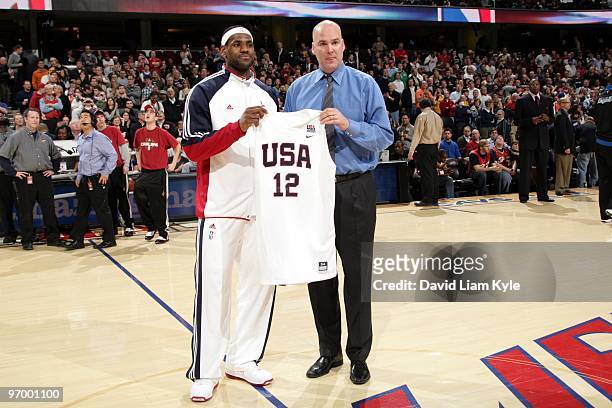 General manager Danny Ferry of the Cleveland Cavaliers presents LeBron James his 2010-12 USA Basketball Men's National Team jersey after the...
