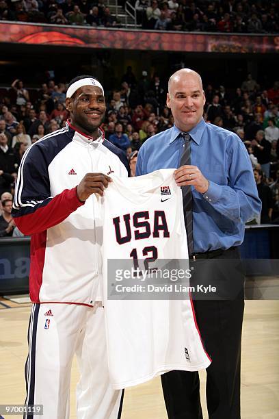 General manager Danny Ferry of the Cleveland Cavaliers presents LeBron James his 2010-12 USA Basketball Men's National Team jersey after the...