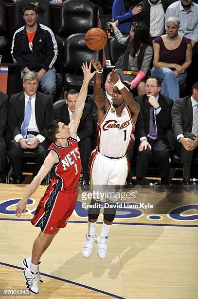 Daniel Gibson of the Cleveland Cavaliers shoots a jump shot against Chris Quinn of the New Jersey Nets during the game at Quicken Loans Arena on...