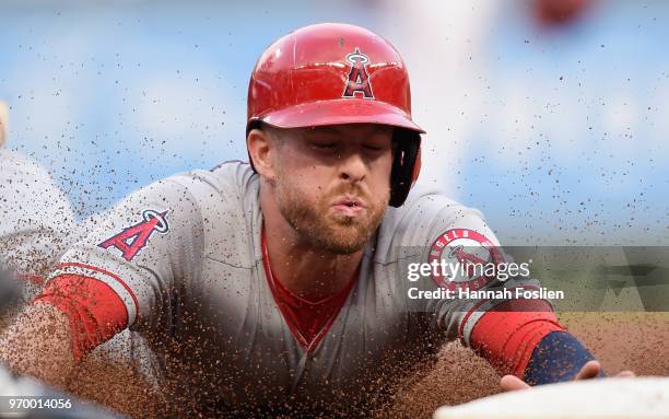 Zack Cozart of the Los Angeles Angels of Anaheim slides safely into third base during the second inning of the game on June 8, 2018 at Target Field...