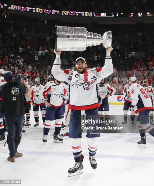 Tom Wilson of the Washington Capitals carries the Stanley Cup in celebration after his team defeated the Vegas Golden Knights 4-3 in Game Five of the...