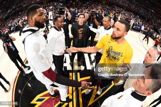 Tristan Thompson of the Cleveland Cavaliers and Stephen Curry of the Golden State Warriors shake hands before the game during Game Four of the 2018...