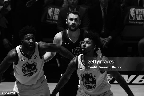 Jordan Bell and Nick Young of the Golden State Warriors fights for position against Kevin Love of the Cleveland Cavaliers during Game Four of the...