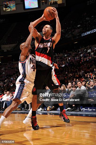 Brandon Roy of the Portland Trail Blazers looks to pass against Trenton Hassell of the New Jersey Nets during the game on February 23, 2010 at the...