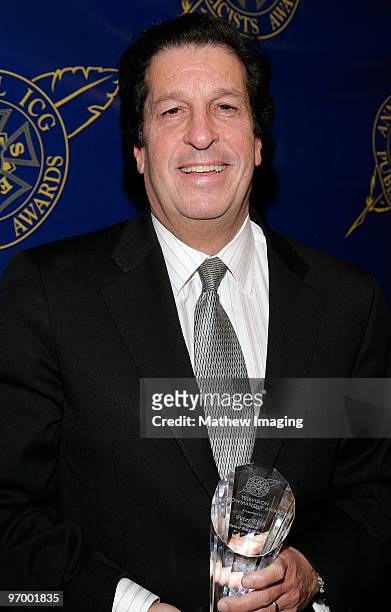 President of Warner Brothers Television Peter Roth poses with the Television Showmanship award backstage during the 45th annual ICG Publicists awards...