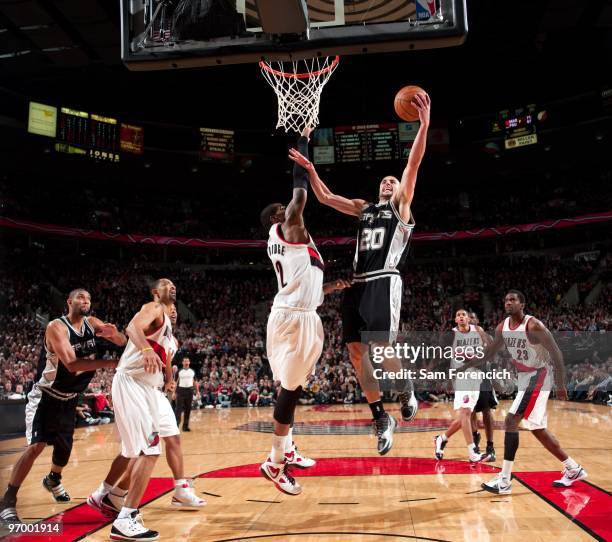 Manu Ginobili of the San Antonio Spurs shoots a layup against LaMarcus Aldridge of the Portland Trail Blazers during the game at The Rose Garden on...