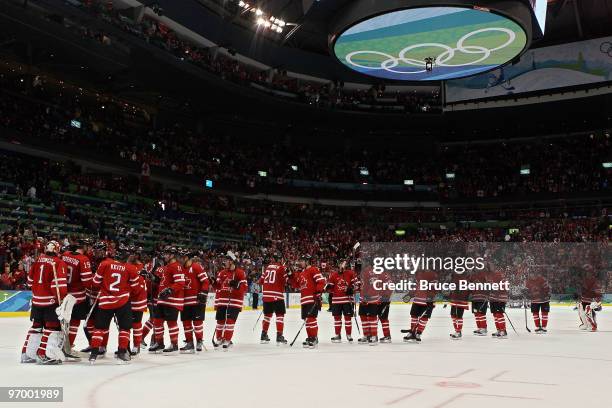 Team Canada celebrates after defeating Germany during the ice hockey Men's Qualification Playoff game between Germany and Canada on day 12 of the...