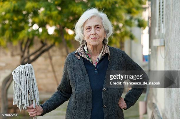 senior woman and mop - terza età 個照片及圖片檔