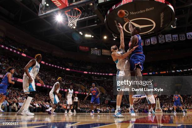 Antawn Jamison of the Cleveland Cavaliers shoots over Peja Stojakovic of the New Orleans Hornets on February 23, 2010 at The Quicken Loans Arena in...