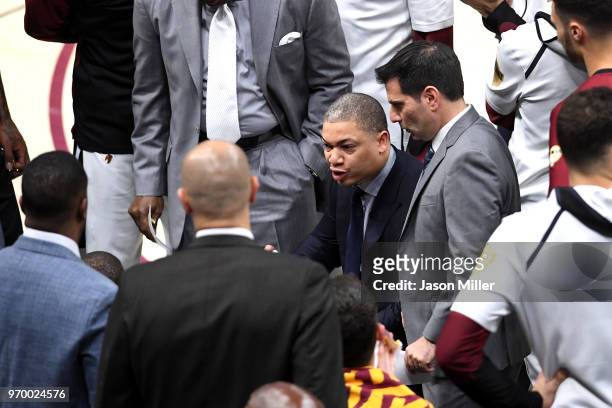 Tyronn Lue of the Cleveland Cavaliers speaks to his team during a time out against the Golden State Warriors in the first half during Game Four of...