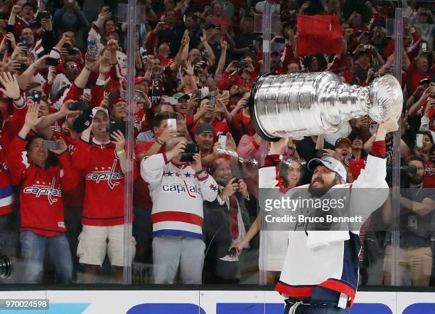 Alex Ovechkin of the Washington Capitals carries the Stanley Cup in celebration after his team defeated the Vegas Golden Knights 4-3 in Game Five of...