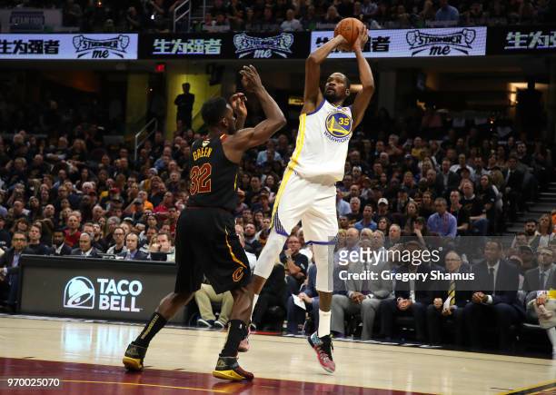 Kevin Durant of the Golden State Warriors shoots against Jeff Green of the Cleveland Cavaliers in the first quarter during Game Four of the 2018 NBA...