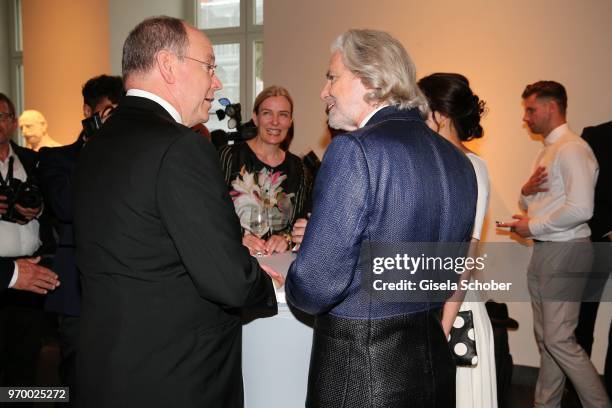 Prince Albert II. Of Monaco and Hermann Buehlbecker, CEO Lambertz during the Lambertz reception before the European Culture Awards TAURUS 2018 at...