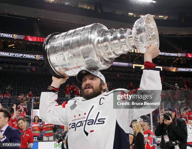 Alex Ovechkin of the Washington Capitals carries the Stanley Cup in celebration after his team defeated the Vegas Golden Knights 4-3 in Game Five of...