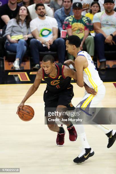 Rodney Hood of the Cleveland Cavaliers handles the ball against Shaun Livingston of the Golden State Warriors in Game Four of the 2018 NBA Finals on...