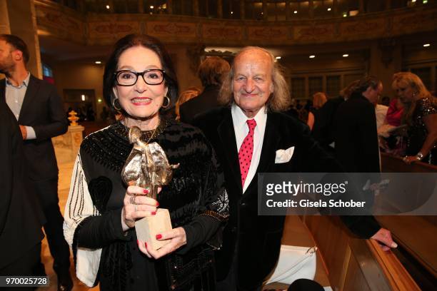 Nana Mouskouri and her husband Andre Chapelle with her award during the European Culture Awards TAURUS 2018 at Dresden Frauenkirche on June 8, 2018...