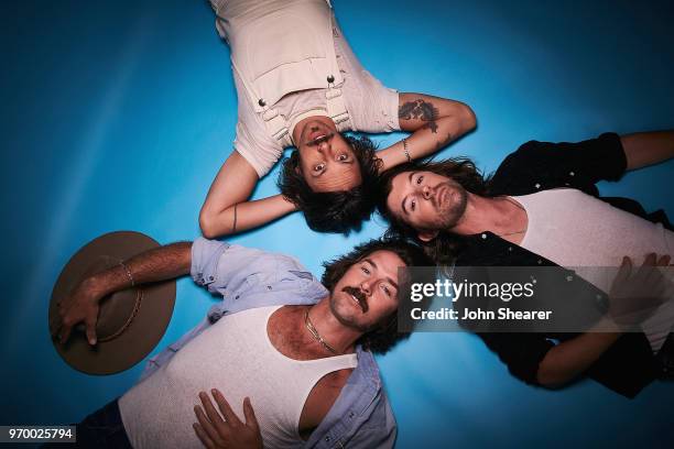 Mark Wystrach, Cameron Duddy, and Jess Carson of Midland pose in the portrait studio at the 2018 CMA Music Festival at Nissan Stadium on June 8, 2018...