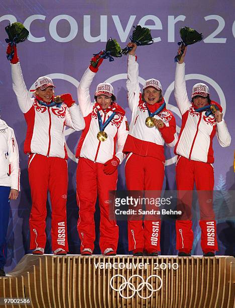 Team Russia celebrates winning the gold during the medal ceremony on day 12 of the Vancouver 2010 Winter Olympics at Whistler Medals Plaza on...