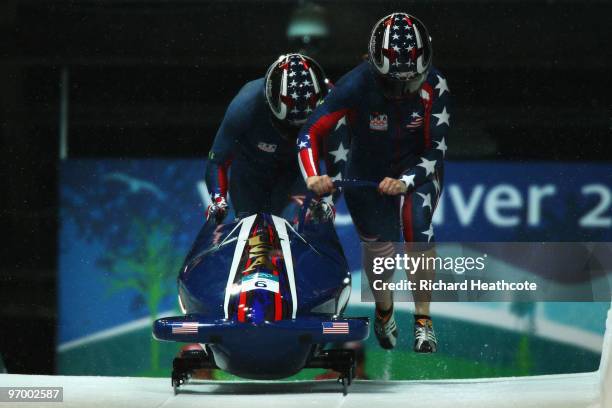 Erin Pac and Elana Meyers of the United States compete in United States 2 during the Women's Bobsleigh Heat 2 on day 12 of the 2010 Vancouver Winter...
