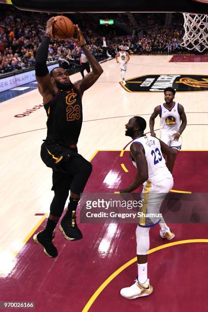 LeBron James of the Cleveland Cavaliers shoots against Draymond Green of the Golden State Warriors in the first half during Game Four of the 2018 NBA...