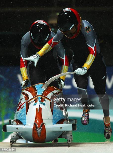 Sandra Kiriasis and Christin Senkel of Germany compete in Germany 1 during the Women's Bobsleigh Heat 2 on day 12 of the 2010 Vancouver Winter...