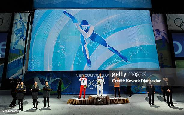 Ivan Skobrev of Russia celebrates winning silver, Lee Seung-Hoon of South Korea gold and Bob De Jong of Netherlands bronze during the medal ceremony...