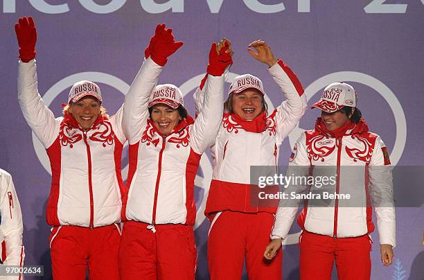 Team Russia celebrates winning the gold during the medal ceremony on day 12 of the Vancouver 2010 Winter Olympics at Whistler Medals Plaza on...