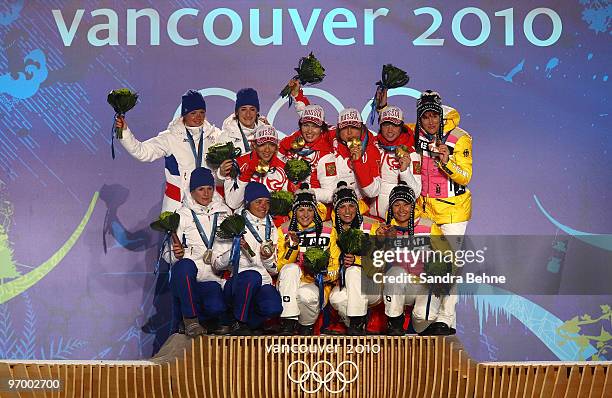 Team France celebrates winning the silver, Team Russia gold and Team Germany bronze in the women's biathlon 4 x 6km relay during the medal ceremony...