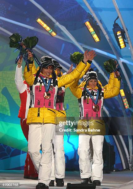 Team Germany celebrates winning the bronze during the medal ceremony for the in the women's biathlon 4 x 6km relay on day 12 of the Vancouver 2010...