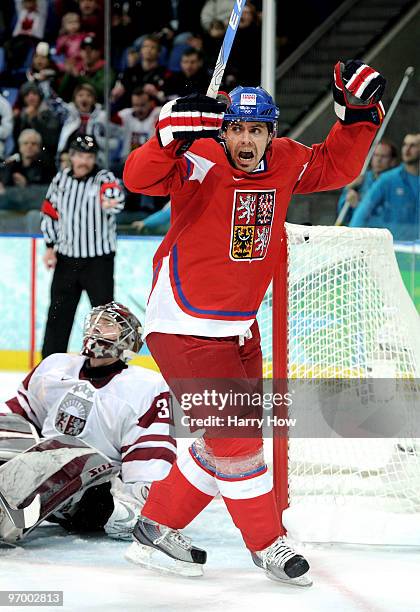 Tomas Rolinek of Czech Republic celebrates after scoring the opening goal past goalkeeper Edgars Masalskis Latvia during the ice hockey Men's...