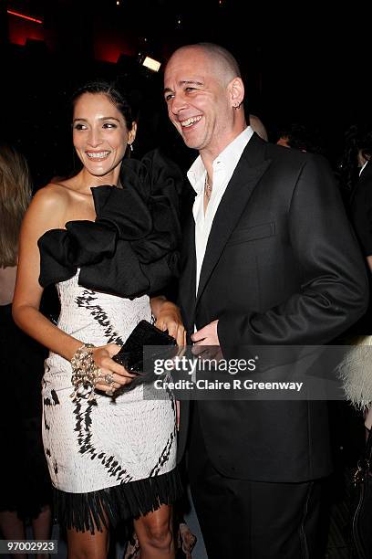 Dinos Chapman and Astrid Munoz laugh at the Love Ball, in aid of The Naked Heart Foundation, at The Roundhouse on February 23, 2010 in London,...