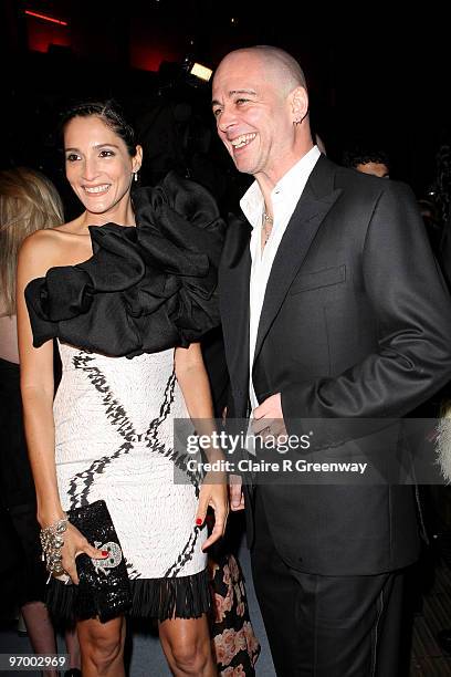 Dinos Chapman and Astrid Munoz laugh at the Love Ball, in aid of The Naked Heart Foundation, at The Roundhouse on February 23, 2010 in London,...