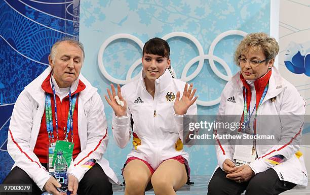 Sarah Hecken of Germany waves in the kiss and cry area in the Ladies Short Program Figure Skating on day 12 of the 2010 Vancouver Winter Olympics at...