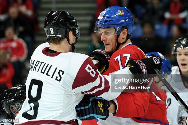 The official steps in to break up a fight between Pavel Kubina of Czech Republic and Oskars Bartulis of Latvia during the ice hockey Men's Play-off...