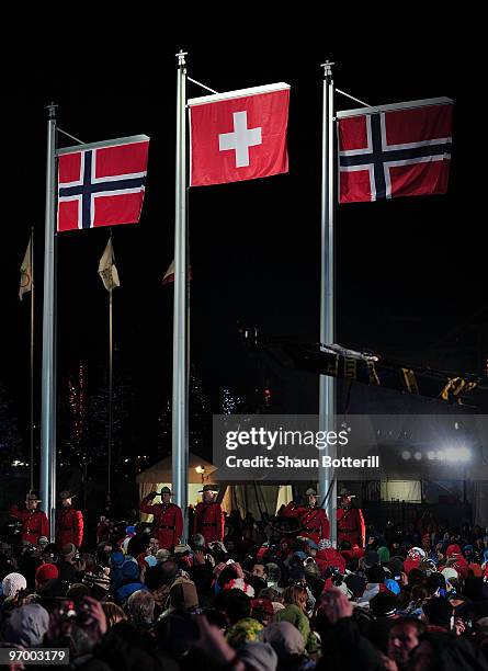 The flags representing silver medalist Kjetil Jansrud of Norway, gold medalist Carlo Janka of Switzerland and bronze medalist Aksel Lund Svindal of...