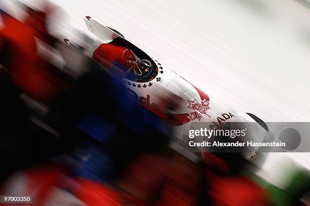 Kaillie Humphries and Heather Moyse of Canada compete in Canada 1 during the Women's Bobsleigh race on day 12 of the 2010 Vancouver Winter Olympics...