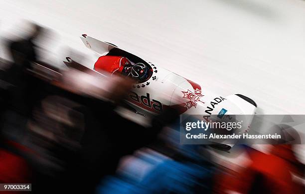 Kaillie Humphries and Heather Moyse of Canada compete in Canada 1 during the Women's Bobsleigh race on day 12 of the 2010 Vancouver Winter Olympics...