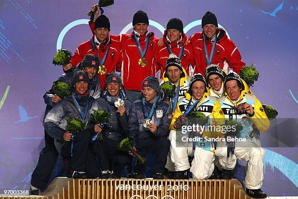 OTeam USA celebrates winning their silver, Team Austria Gold and Team Germany their Bronze in the Nordic Combined team relay during the medal...