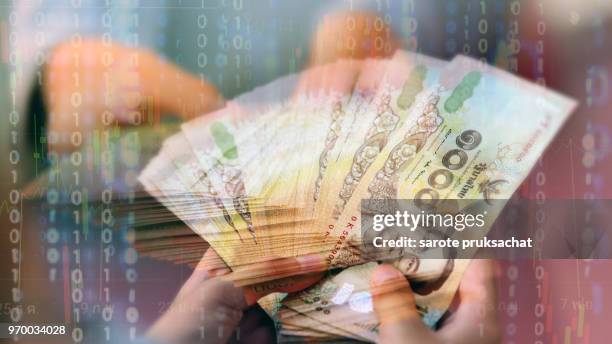 double exposure of  business man hand holding thailand banknote ,finances and economy concept . - man double exposure profit concept imagens e fotografias de stock